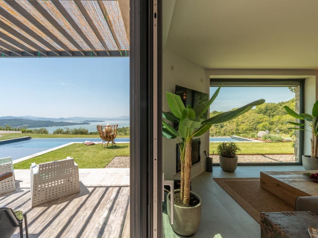Villa Feronia | Luxury lakeside villa and pool, Passignano