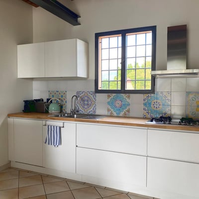 The kitchen has been rebuilt, it now has a dishwasher and a washing machine is in the door on the left