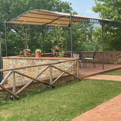 The covered pergola is the perfect spot for lunch