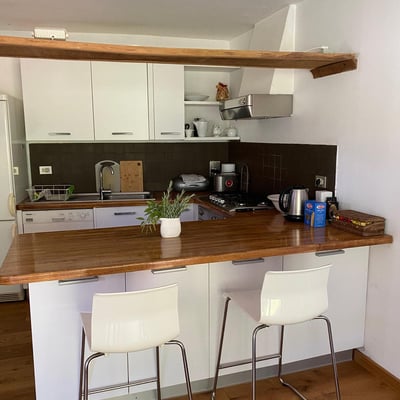 The kitchen is small but well-equipped