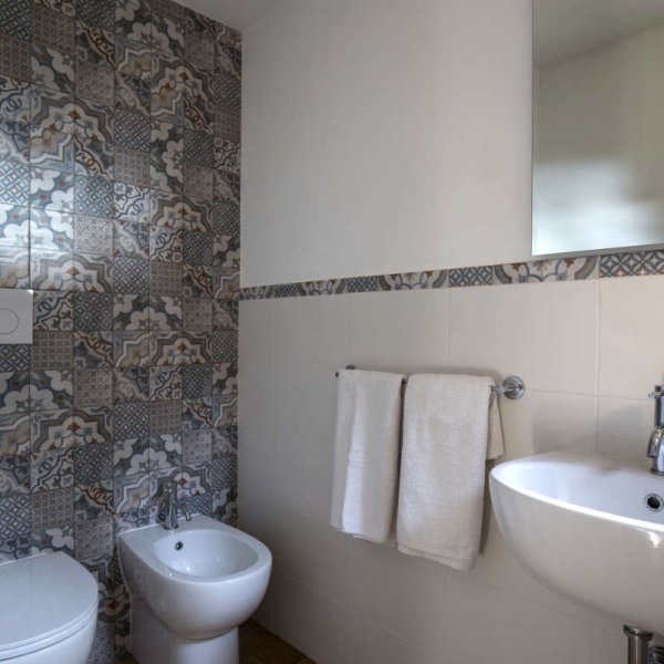 The shower room, decorated with old tiles