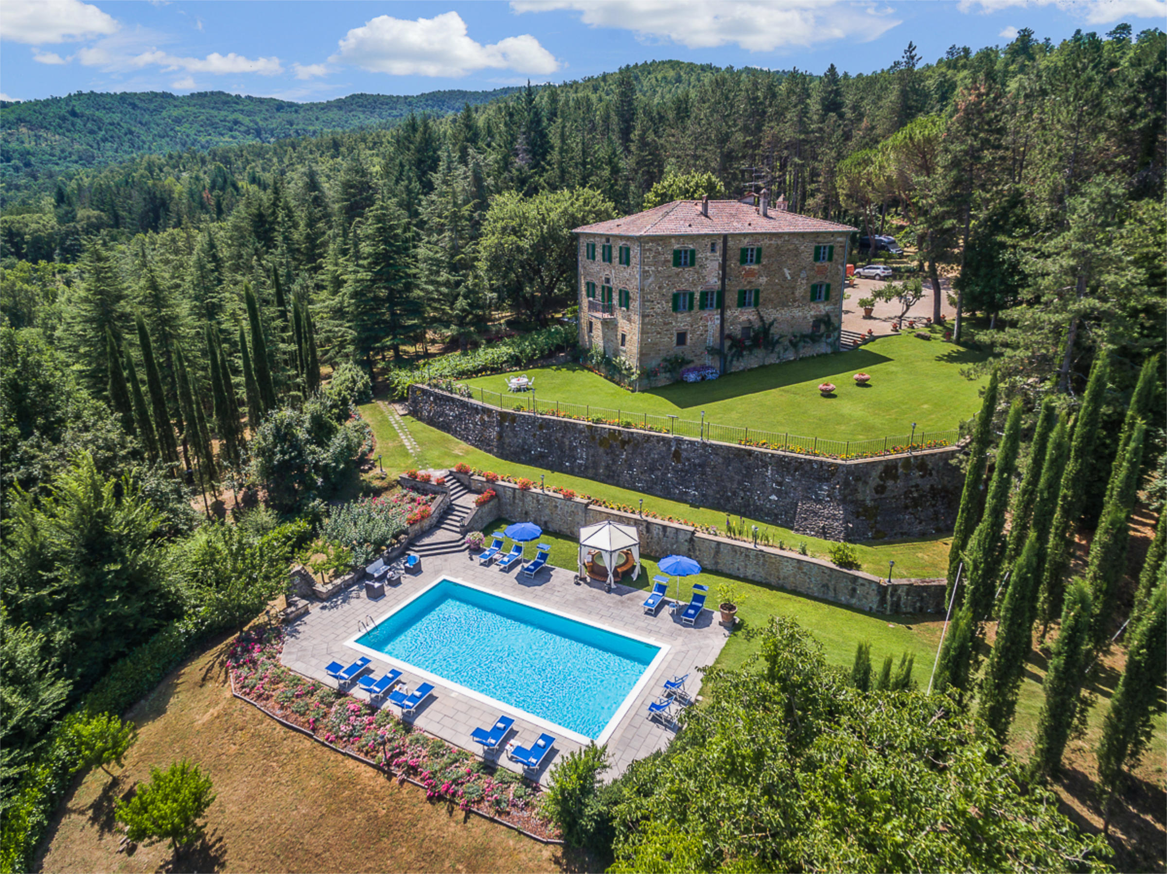 Villa di Monterchi aerial view showing pool and historic palazzo